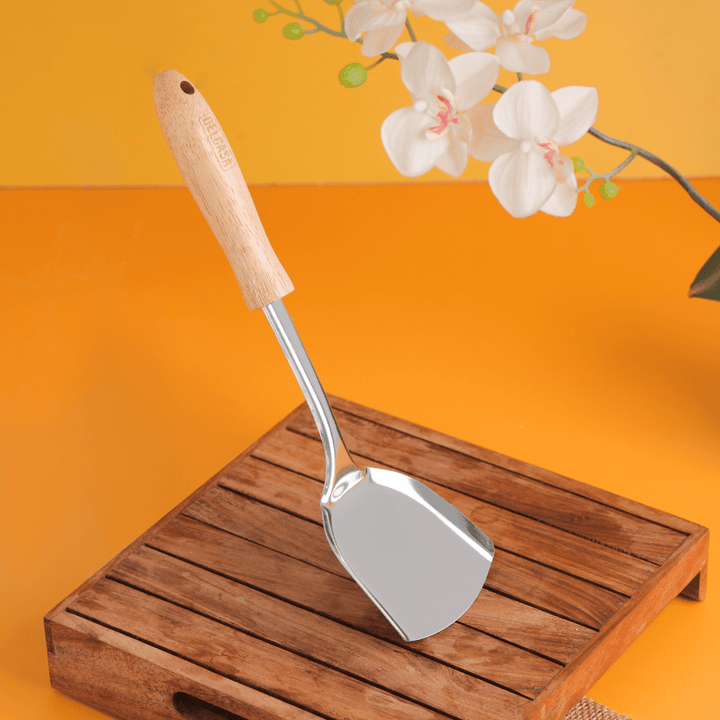 High - Quality Stainless Steel Solid Turner with Wooden Handle - Souk Al RasCooking Utensils